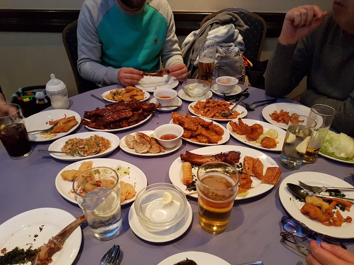 A table spread of ribs, dumplings and shared dishes